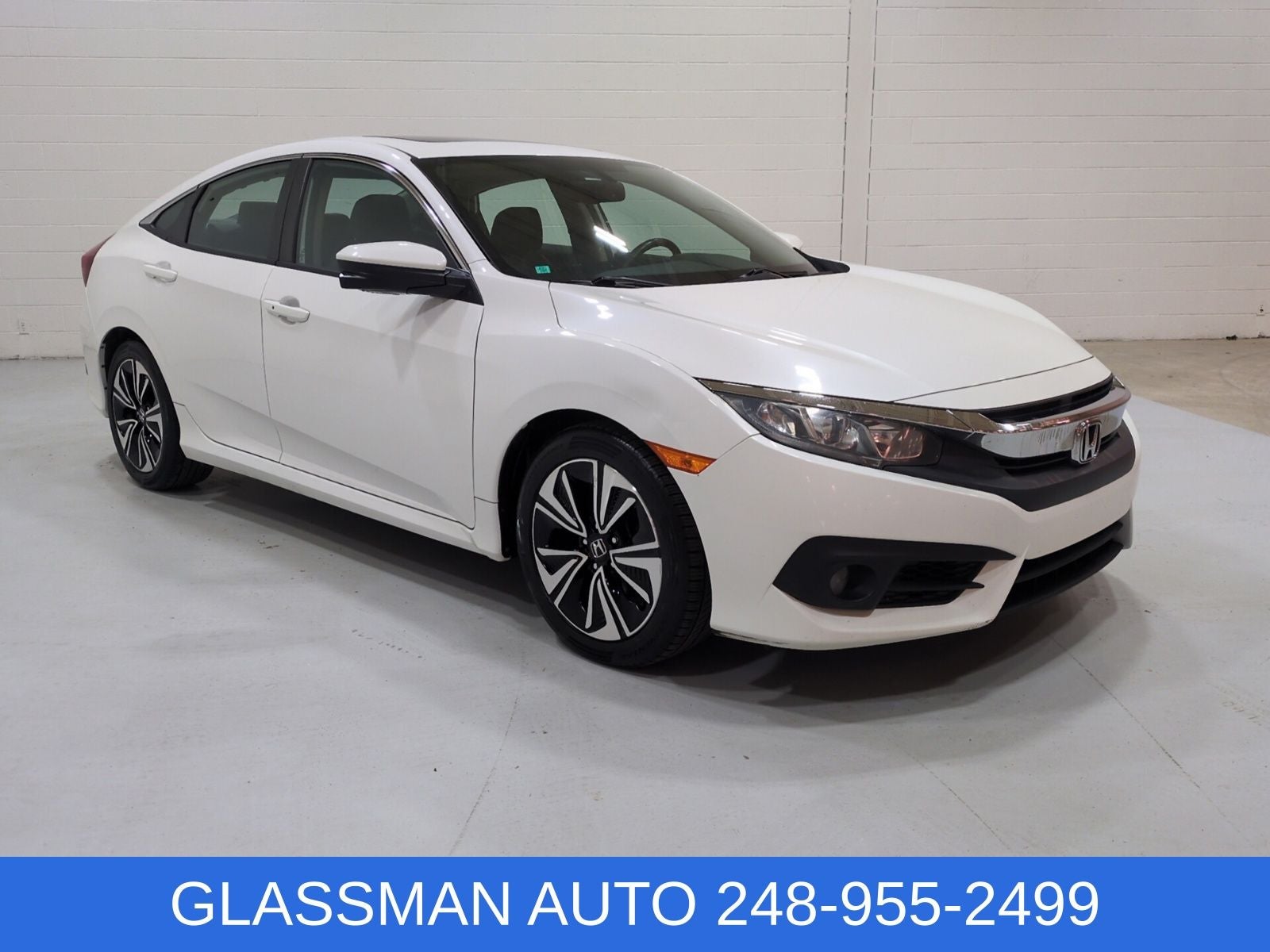 2016 Honda Civic EX-L in White — front three-quarter view
