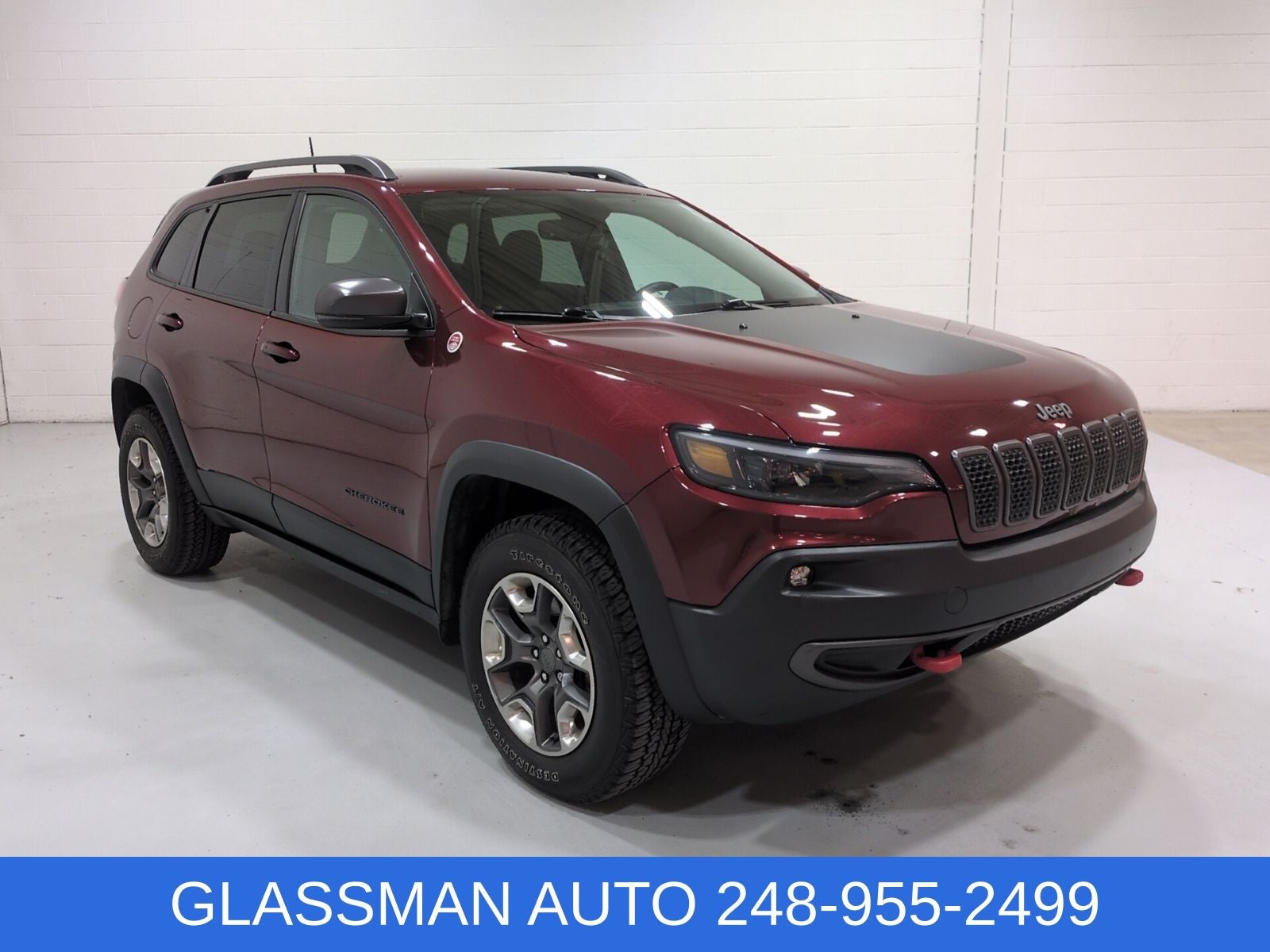 2019 Jeep Cherokee Trailhawk in Velvet Red Pearlcoat — front three-quarter view