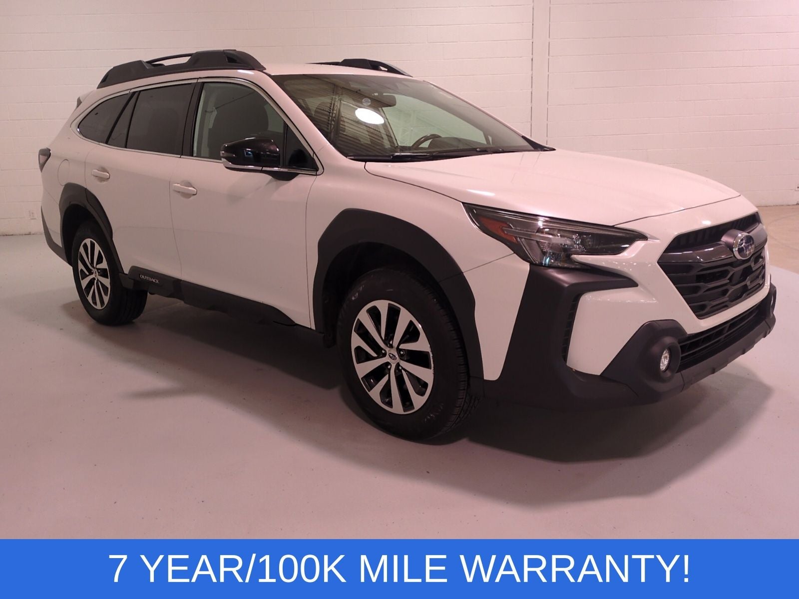2023 Subaru Outback Premium in Crystal White Pearl — front three-quarter view