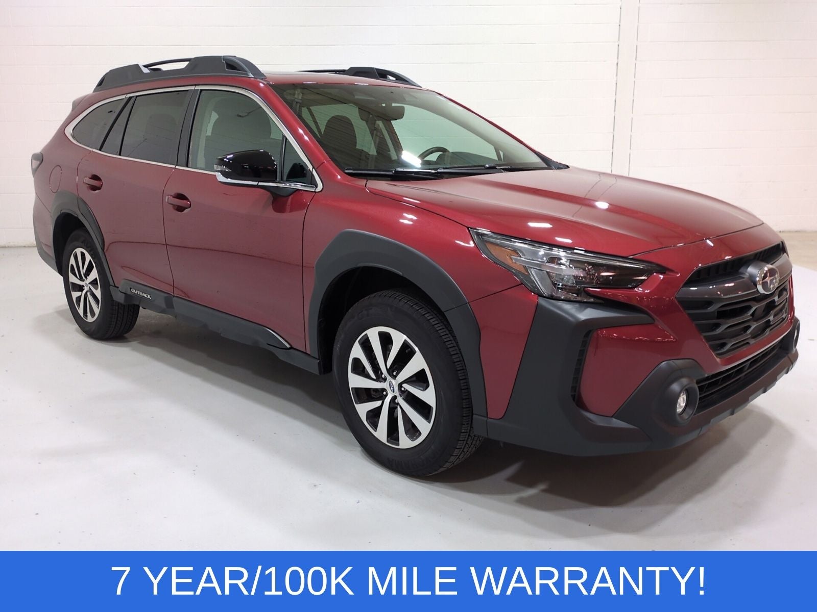 2025 Subaru Outback Premium in Crimson Red Pearl — front three-quarter view