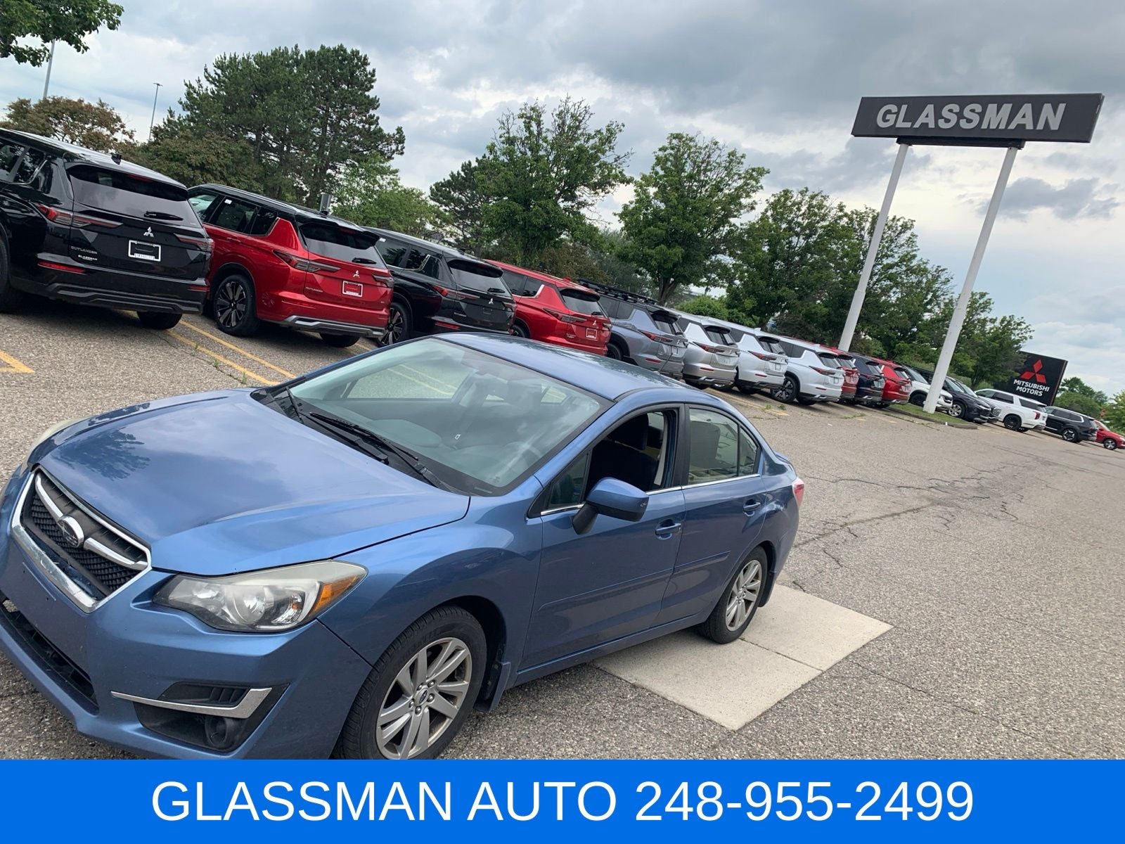 2016 Subaru Impreza 2.0i Premium in Quartz Blue Pearl — front three-quarter view