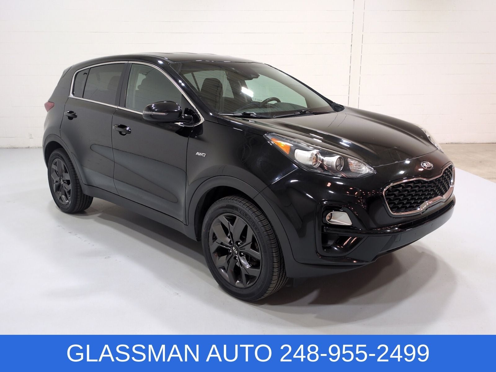 2022 Kia Sportage LX in Black Cherry Pearl — front three-quarter view